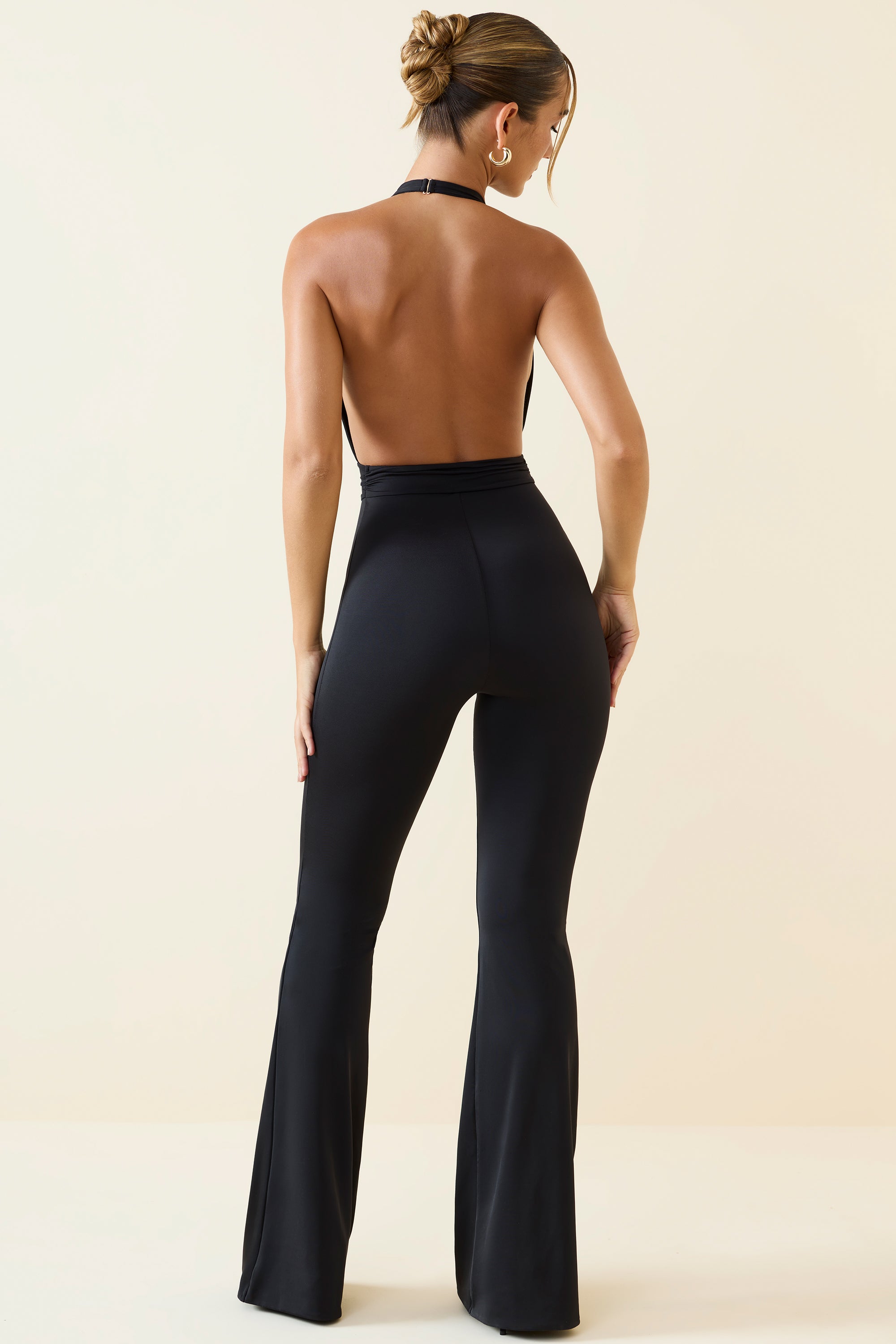 Zenaida-Halterneck Cut-Out Flared Jumpsuit in Black