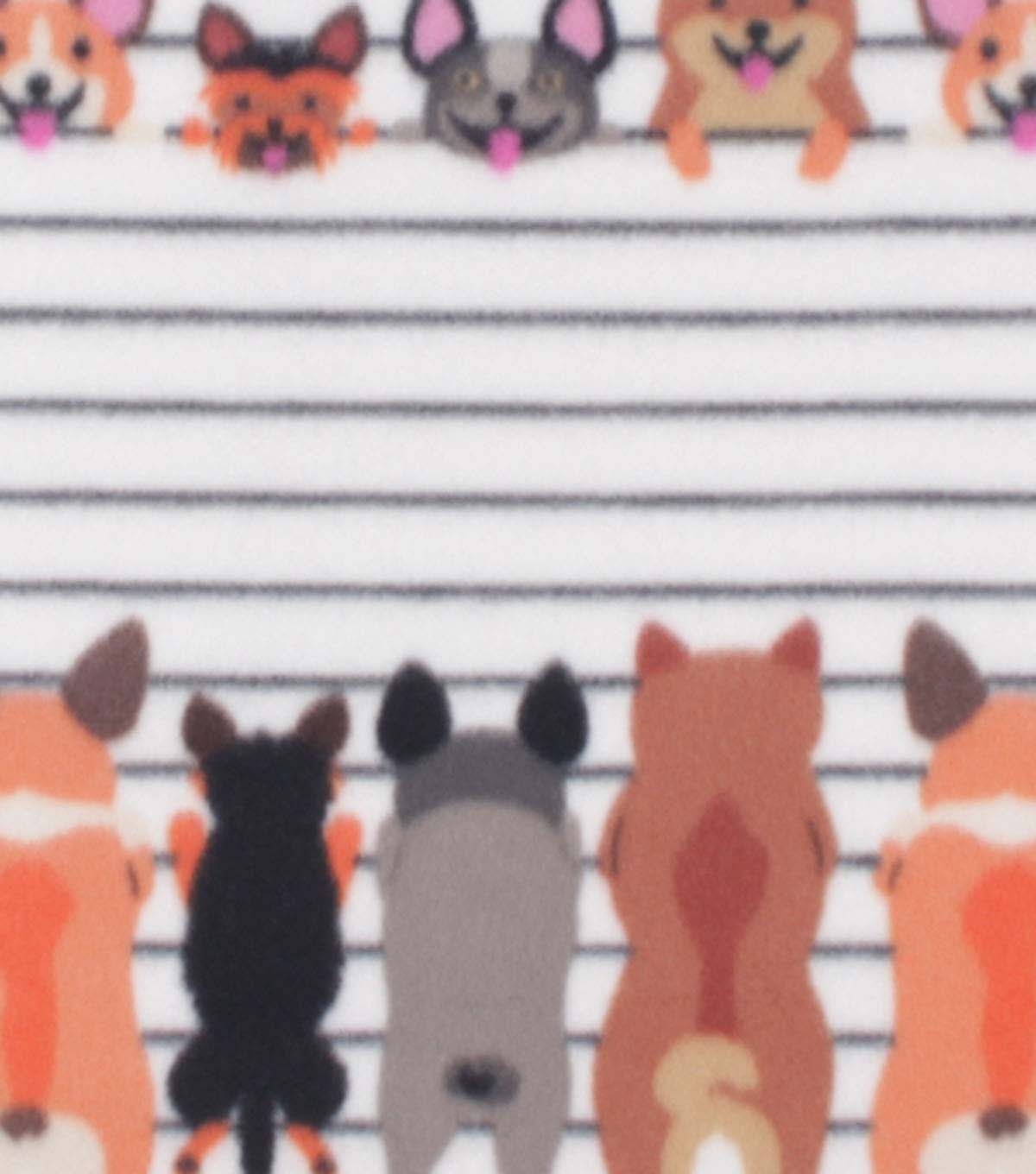 Doggies on White Fence Blizzard Fleece Fabric