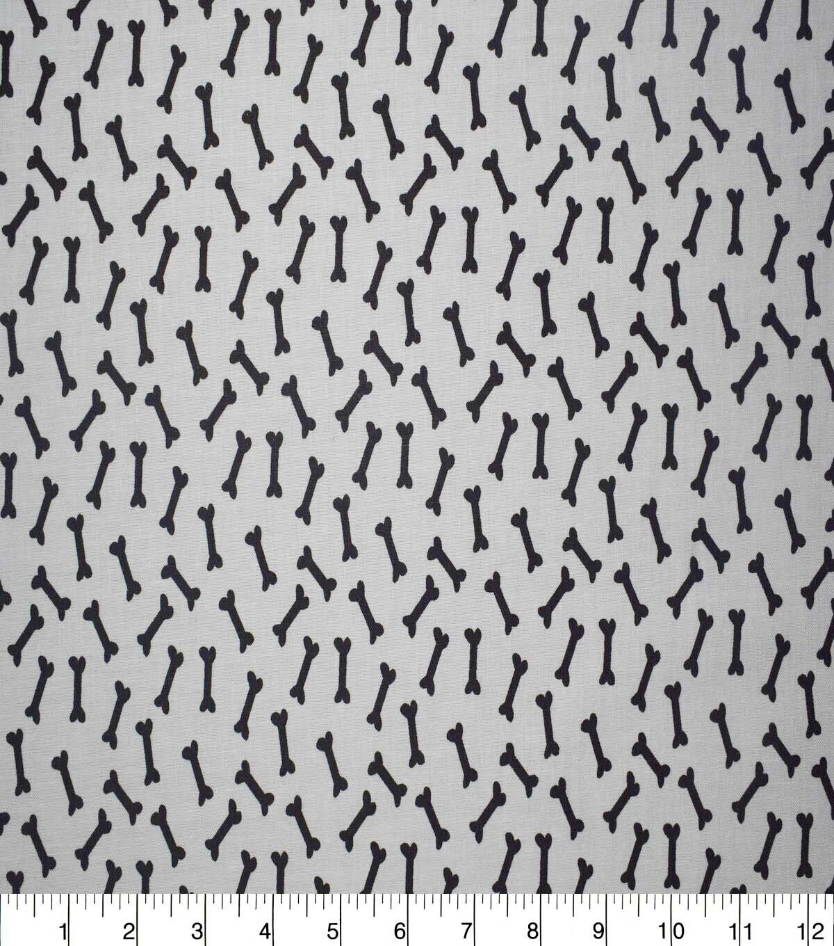 Dog Bones on White Cotton Fabric by Quilter's Showcase